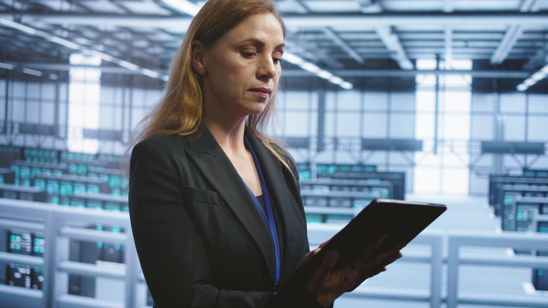 Students collaborating on mobile app design projects in modern workspace